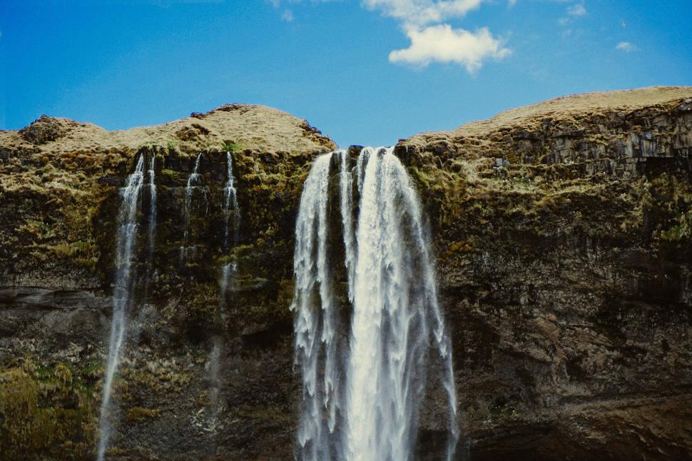 Free Image of Majestic waterfall in a natural landscape 