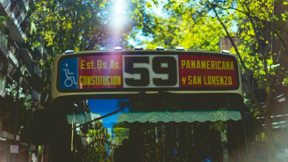 Free Image of Bus with destination sign in the city at sunset 