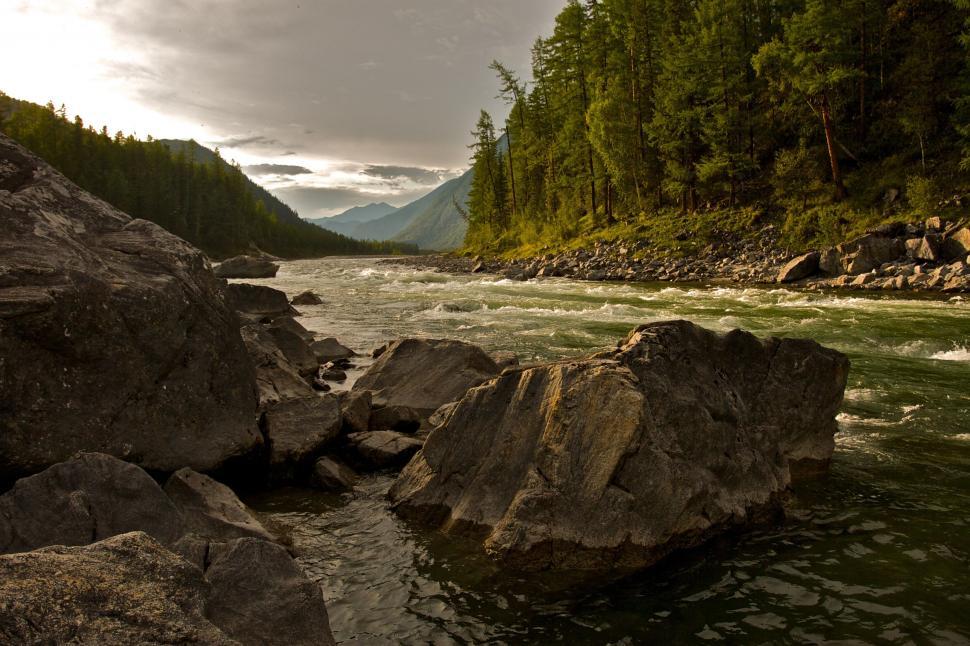 Free Image of Misty River Running through Rocky Landscape 