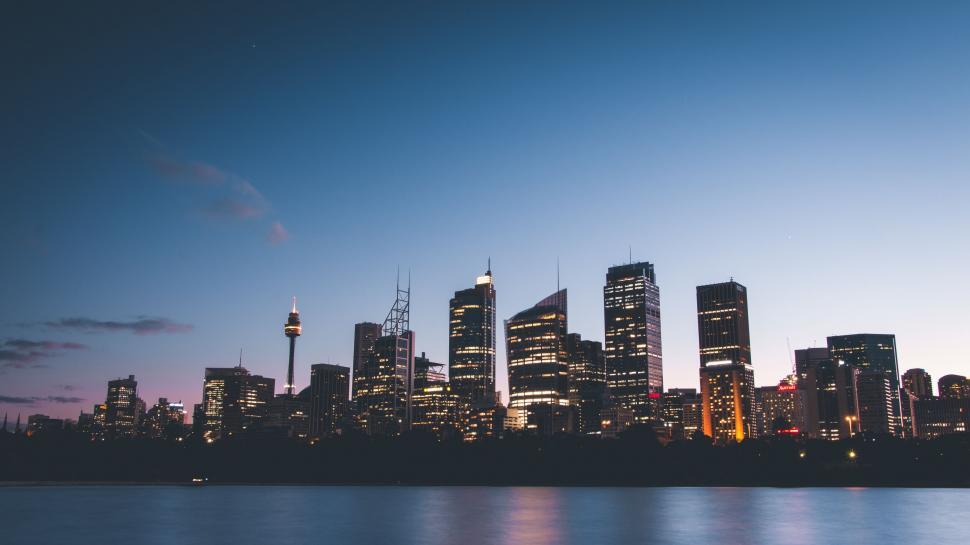 Free Image of Twilight city skyline with illuminated buildings 