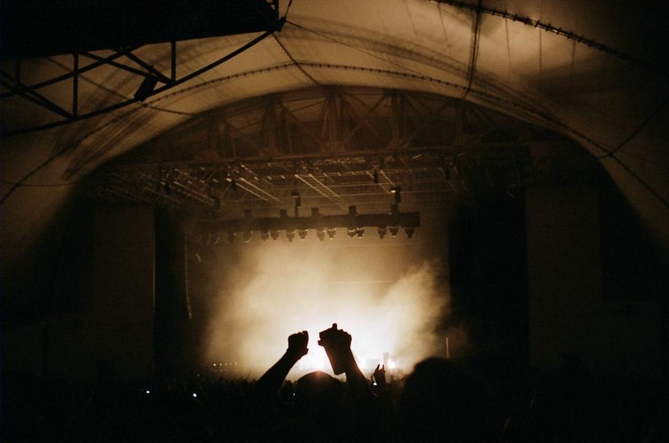 Free Image of Concert audience with hands raised in the air 