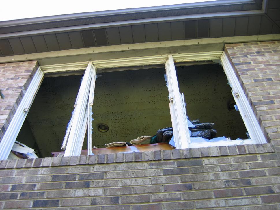 Free Image of Partially Opened Window in Brick Building 