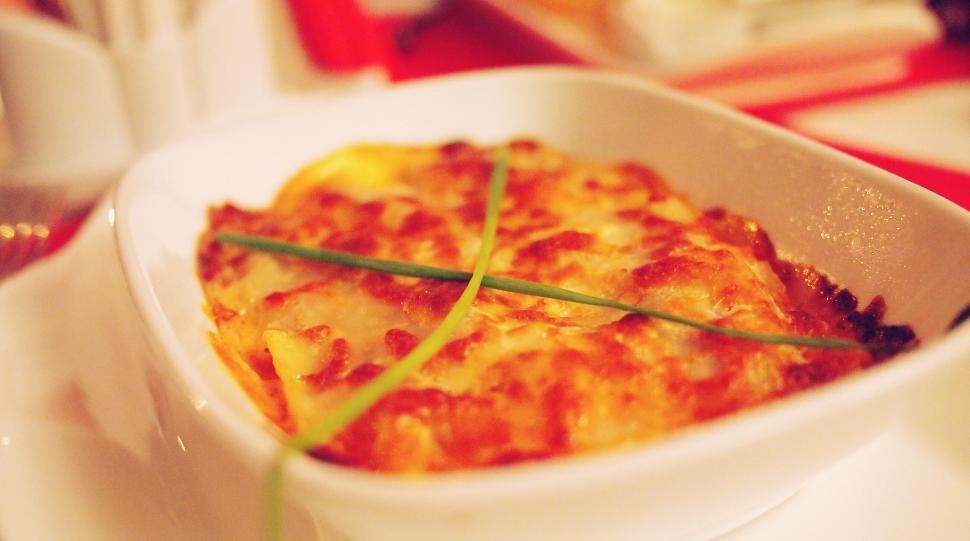 Free Image of Cheesy lasagna dish in white ceramic 