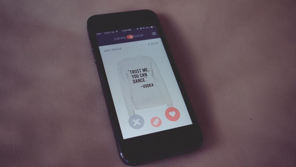 Free Image of Smartphone showing shopping app with sweater 