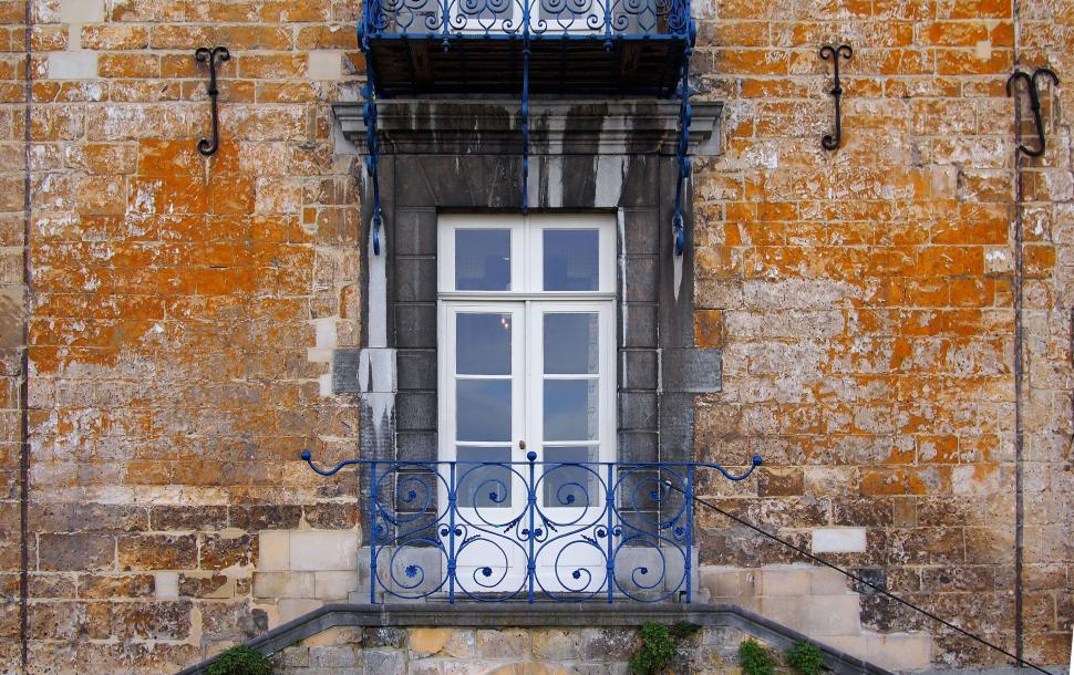 Free Image of Vintage blue balcony on a stone house 