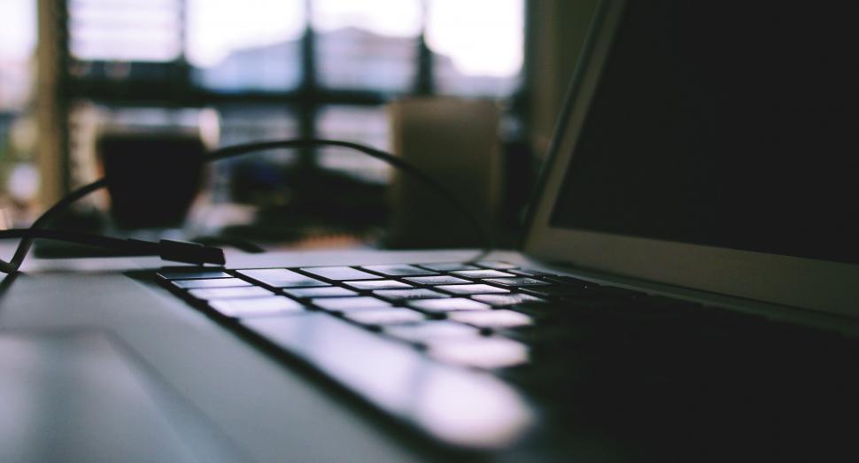 Free Image of Laptop and smartphone on a wooden desk 