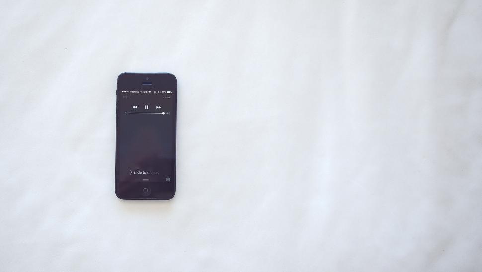 Free Image of Black smartphone on a white surface 