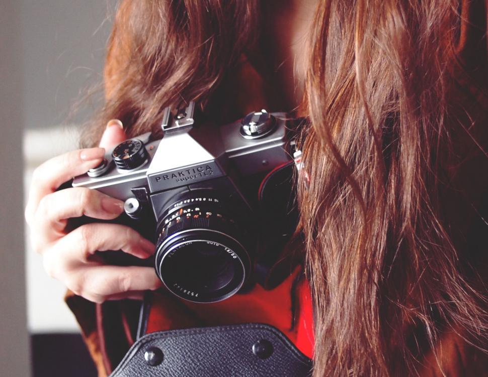 Free Image of Person holding a vintage Praktika camera 