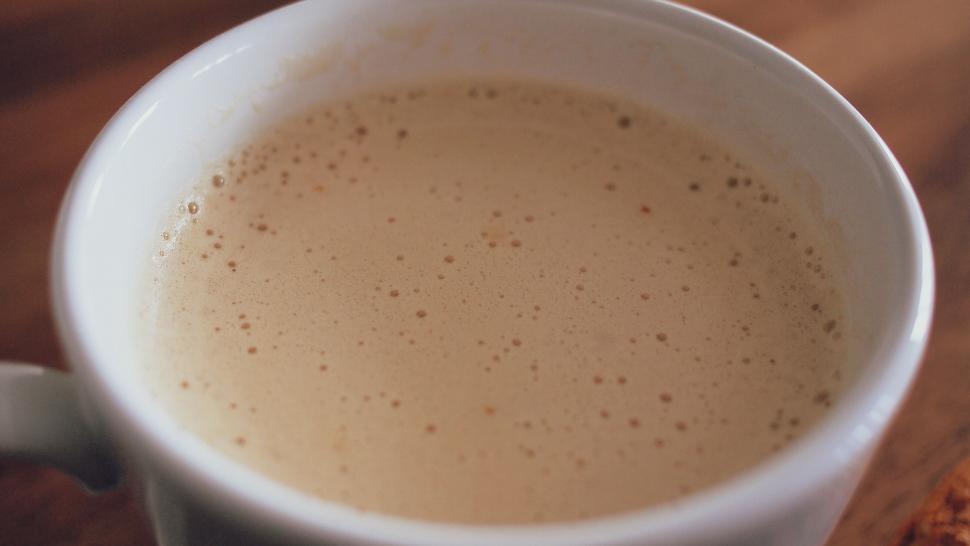 Free Image of Close-up of frothy coffee in a white cup 