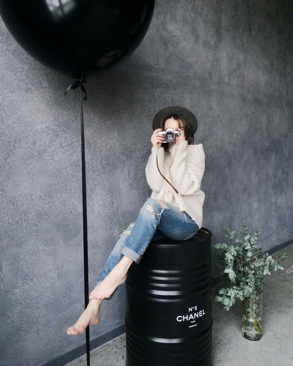 Free Image of Edgy fashion shot with oil drum and balloon 
