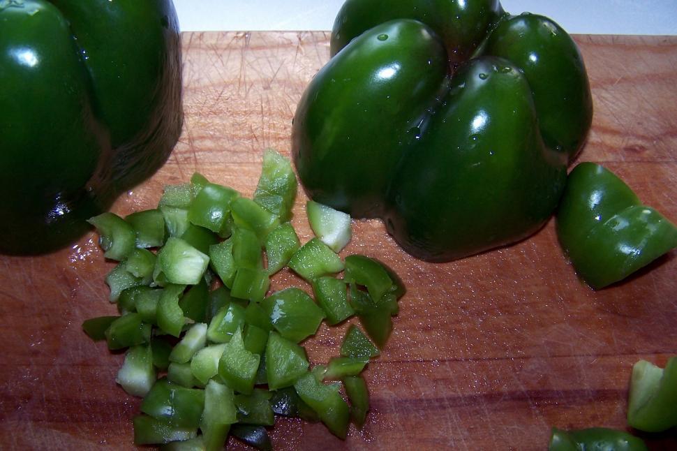 Free Image of Wooden Cutting Board With Green Peppers 