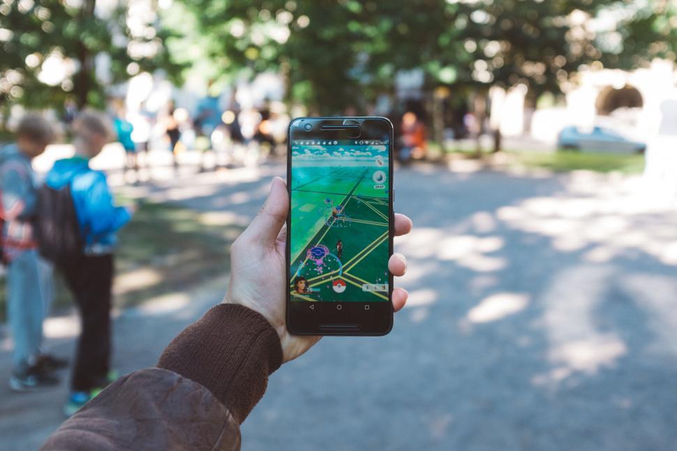 Free Image of Person Holding Up Cell Phone to Take a Picture 
