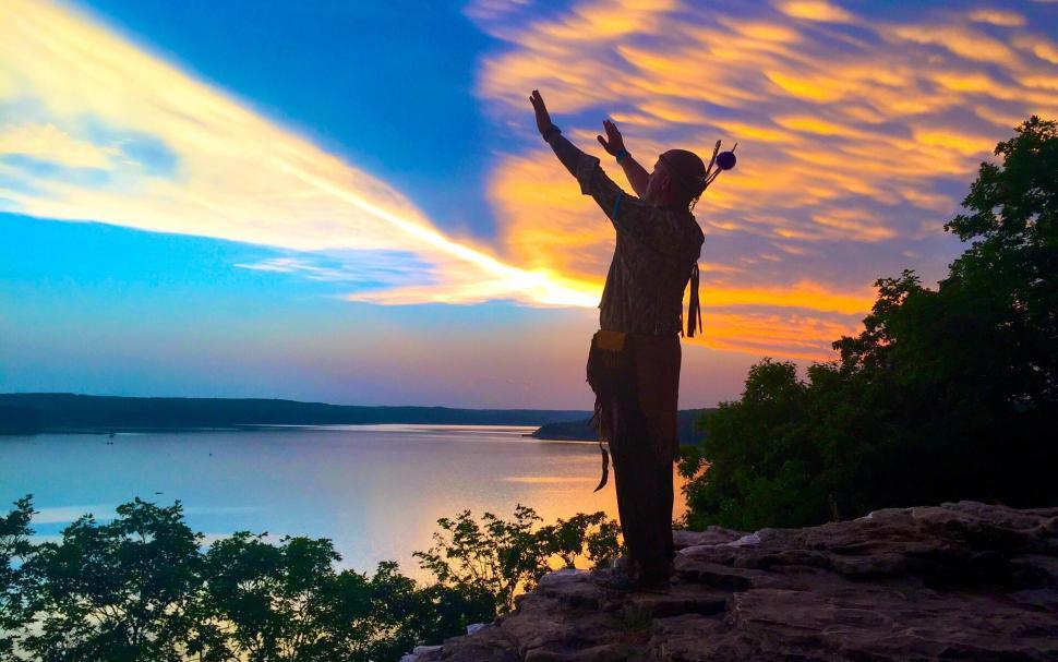 Free Image of Silhouette of a person showing victory sign 