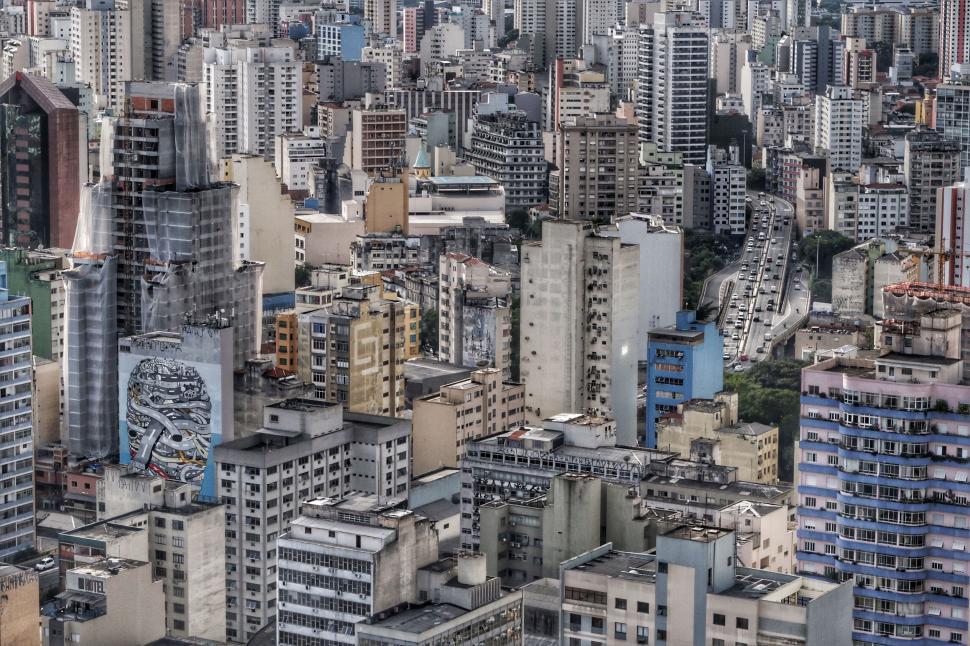 Free Image of Dense urban skyline with graffiti artwork 