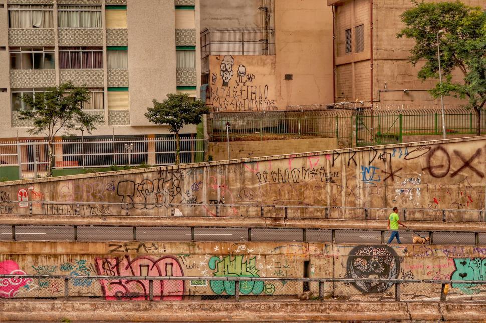 Free Image of Graffiti-covered walls along city canal 