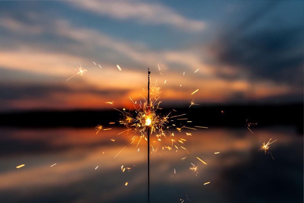 Free Image of Sparkler igniting against a twilight backdrop 