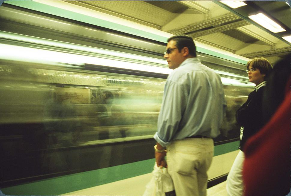 Free Image of People Watching Subway Train 