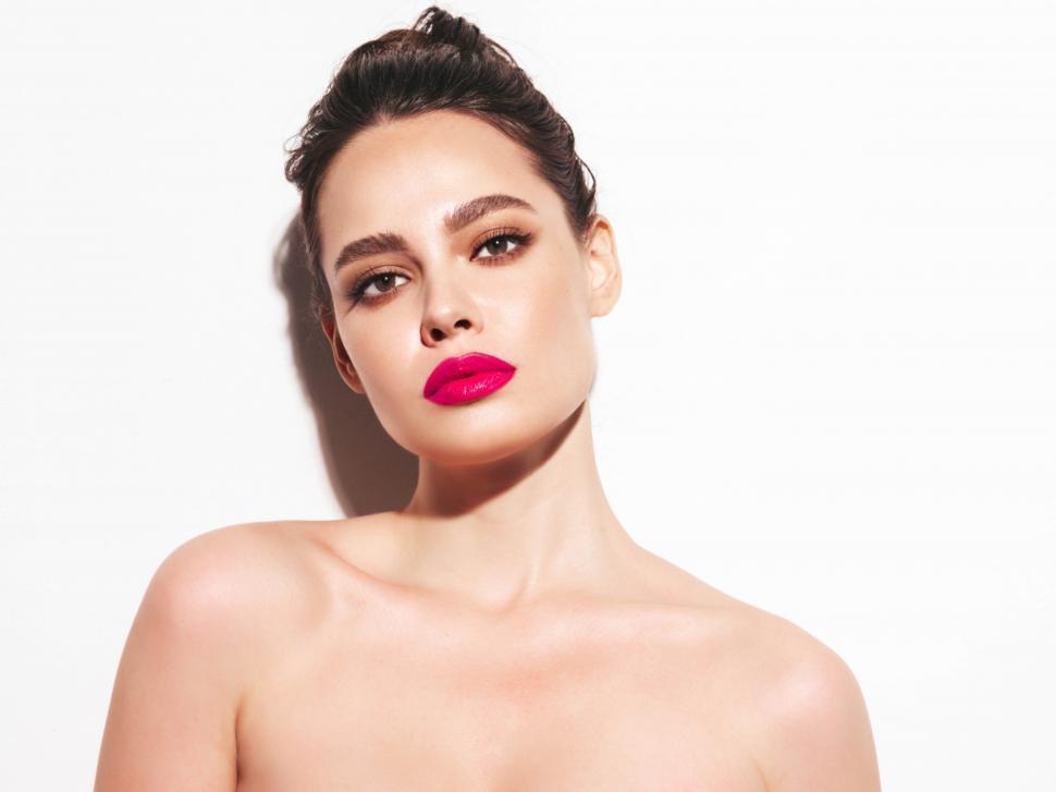 Free Image of A woman with pink lipstick 
