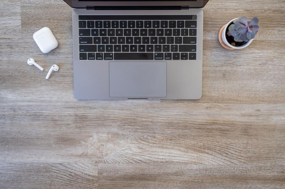 Free Image of Top view of a laptop on a wooden desk 