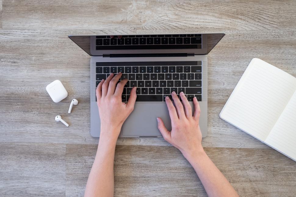 Free Image of Overhead shot of person using laptop 