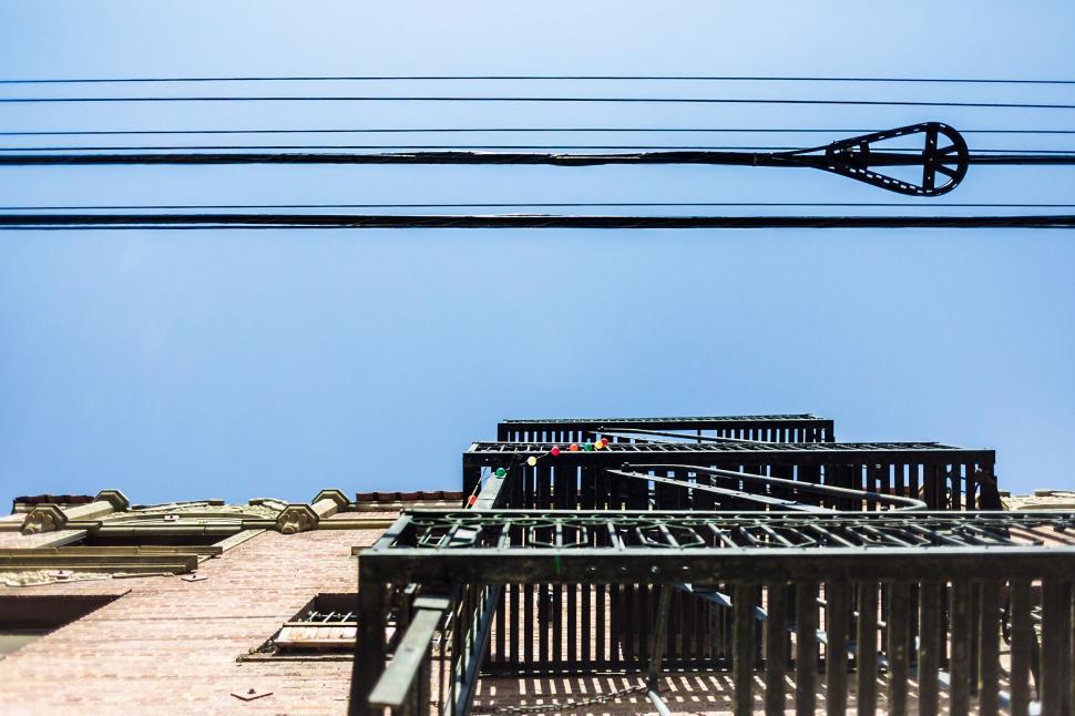 Free Image of Fire escape ladders on a building facade 