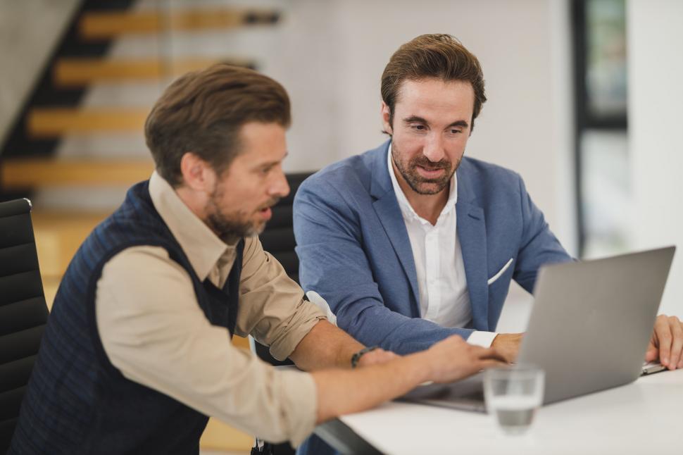 Free Image of Two businessmen engaged in a discussion 