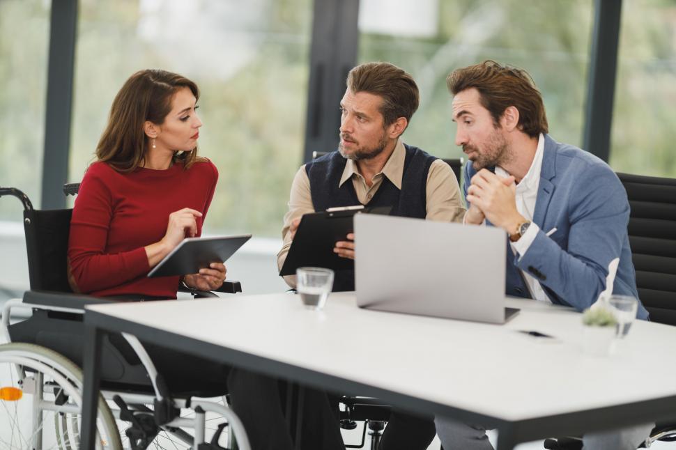 Free Image of Business team discussing wheelchair user s needs 