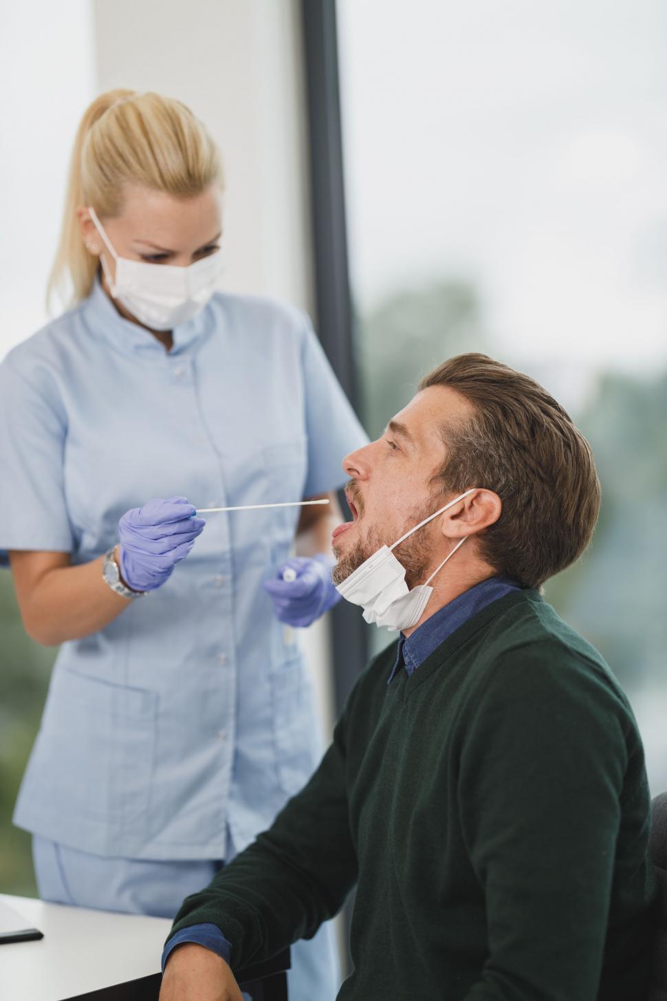 Free Image of Nurse preparing to perform a COVID-19 test 