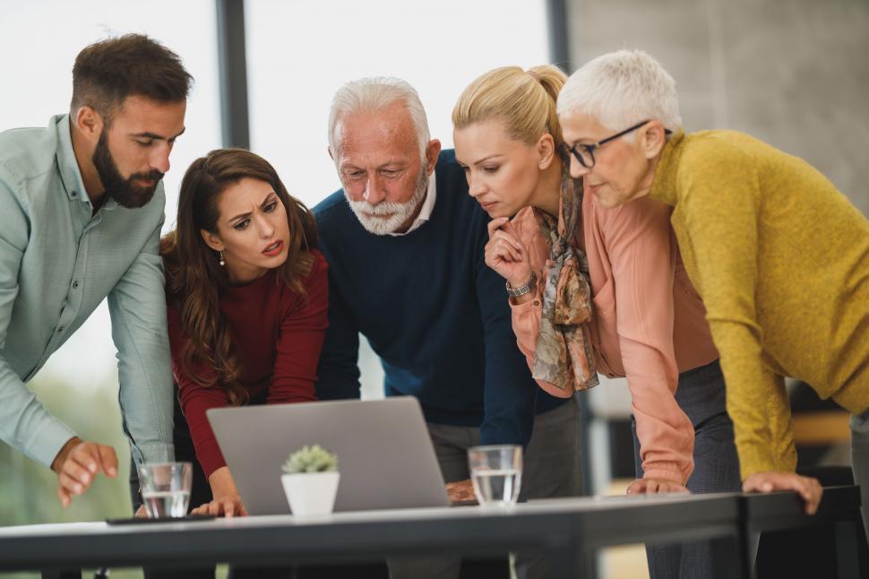 Free Image of Team analyzing data on a laptop 