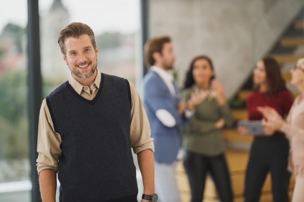 Free Image of Smiling man in a business environment 