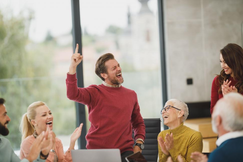 Free Image of Enthusiastic man celebrating with team 
