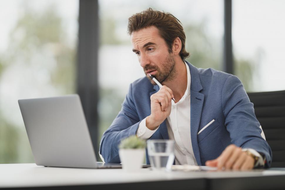 Free Image of Focused businessman working on laptop 