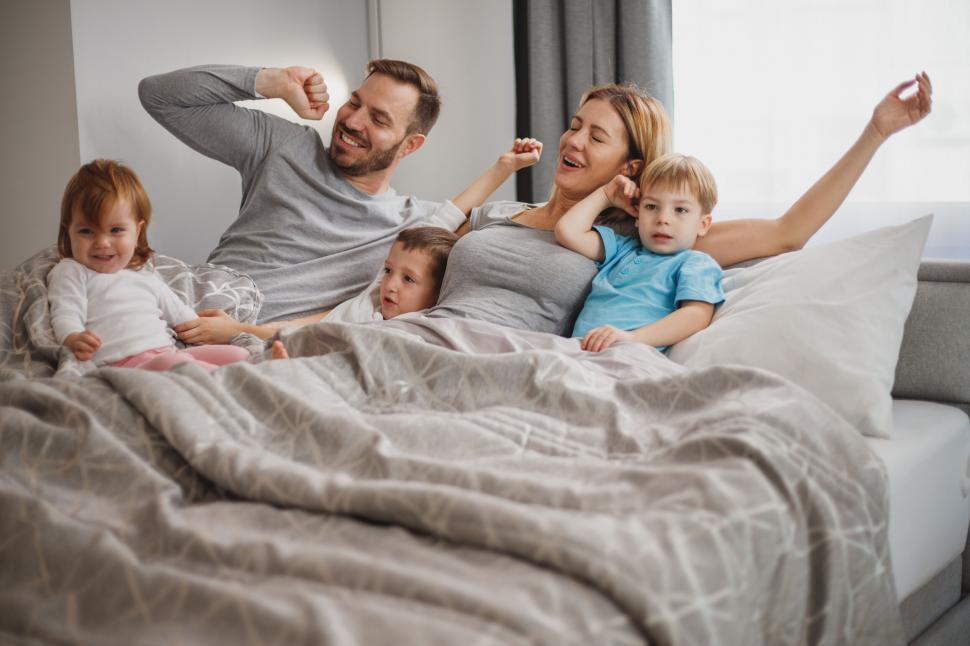 Free Image of Family having fun in bed in the morning 