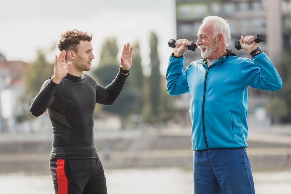 Free Image of Two men stretching before exercise outdoors 