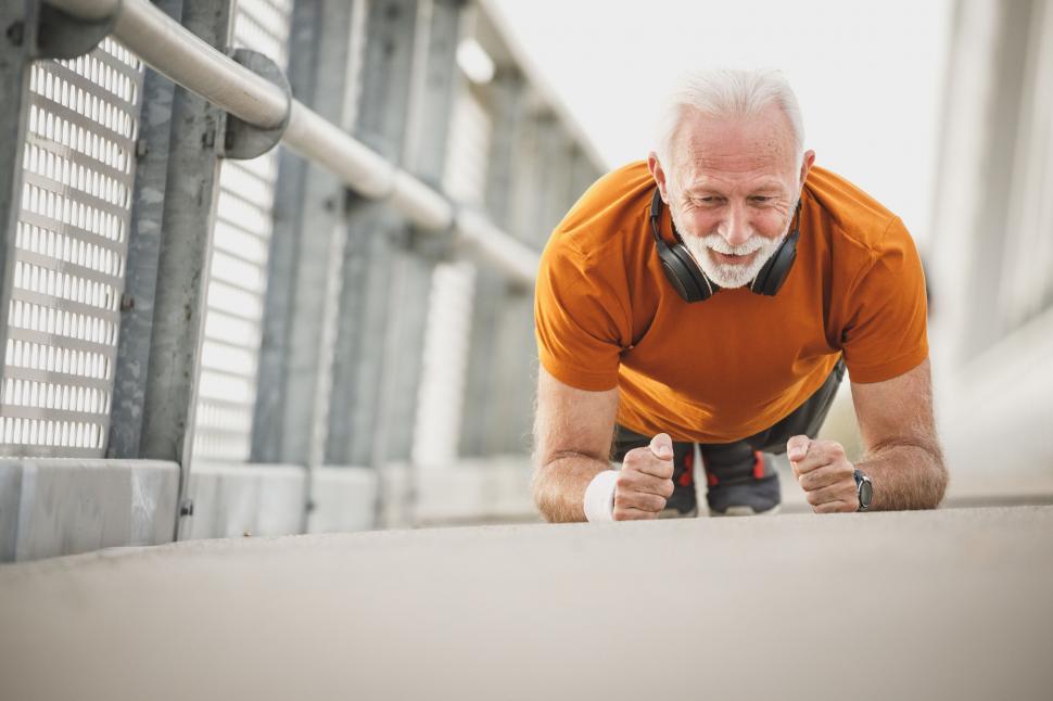 Free Image of Senior man doing push-ups outdoors 