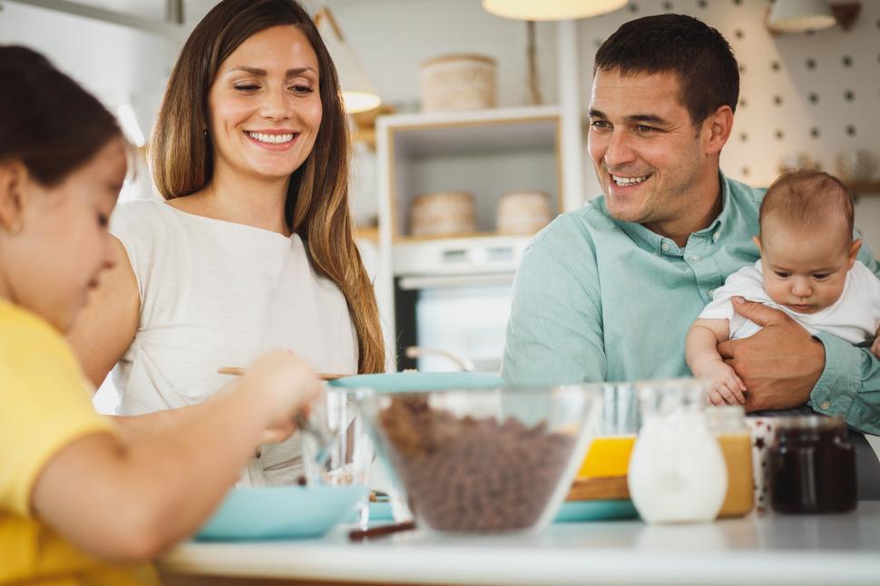 Free Image of Happy family enjoying breakfast together 