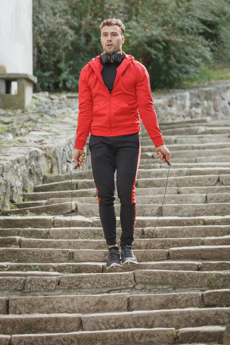 Free Image of Young man skipping rope outdoors 