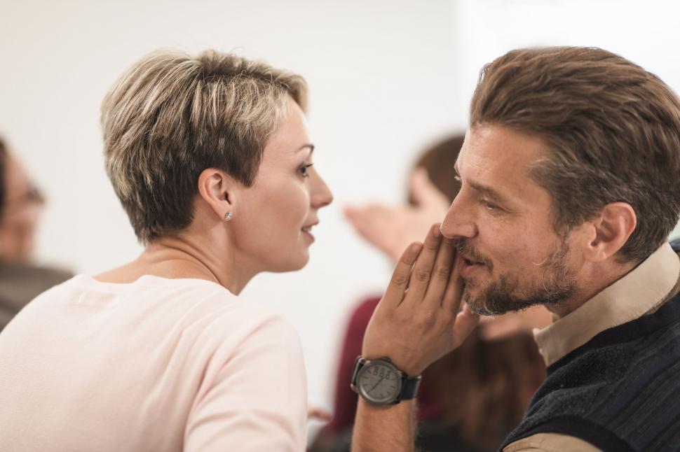 Free Image of Couple sharing secrets and having fun 
