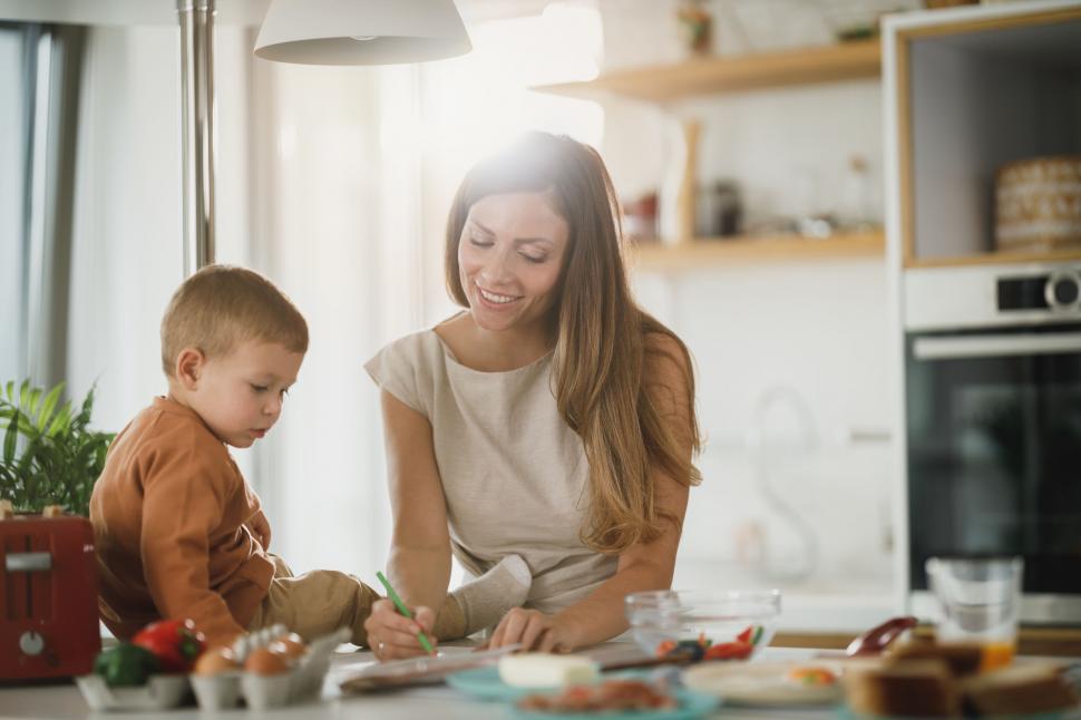 Free Image of Mother and child having fun with drawing activity 