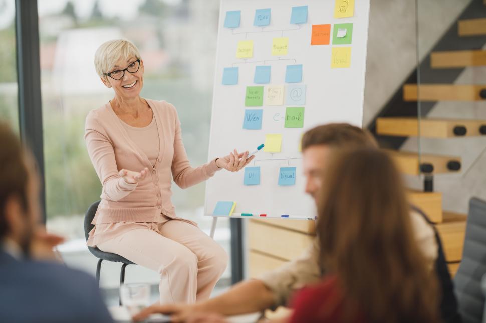 Free Image of Team leader explaining a project at a meeting 