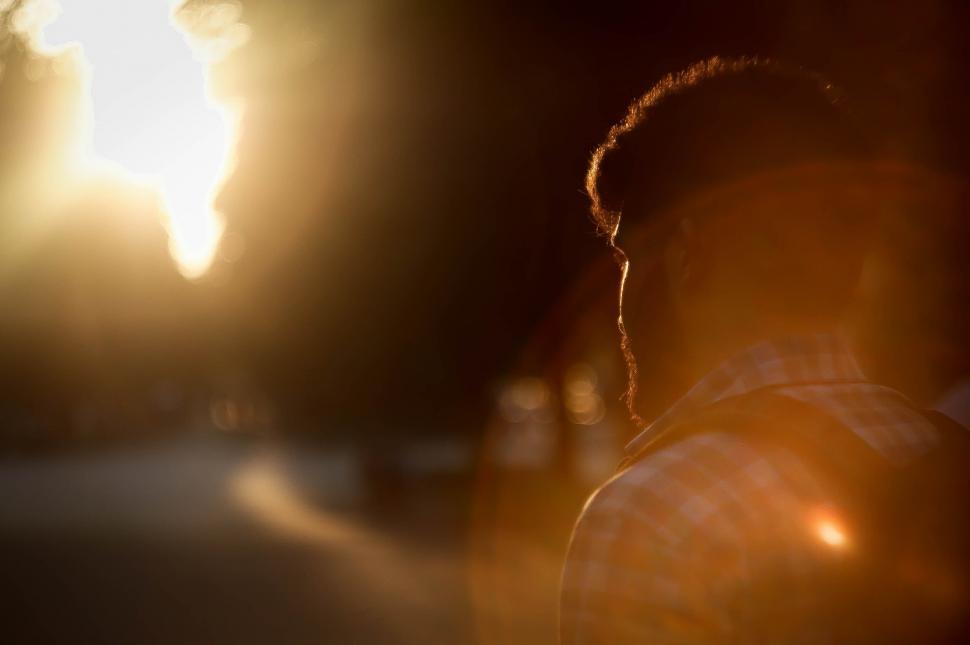 Free Image of Silhouette of man in sunset s golden light 