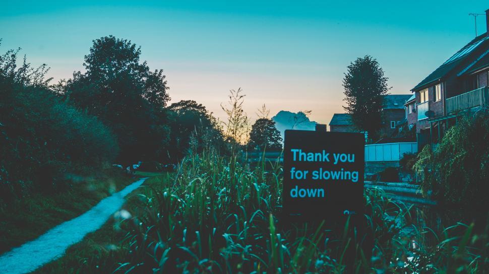 Free Image of Roadside sign among nature during twilight 