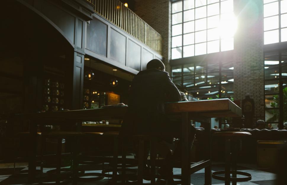 Free Image of Silhouette of a person working on a laptop 