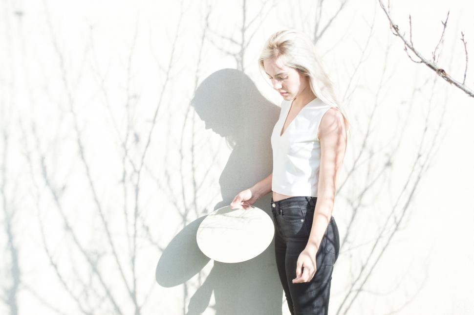 Free Image of Woman with white hair in sunny backdrop 