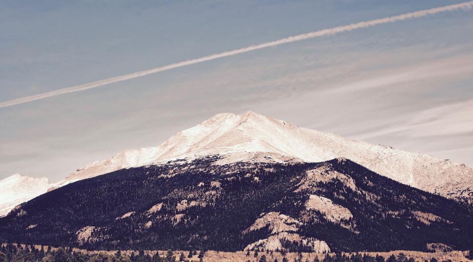 Free Image of Snow-capped mountain peak against sky 