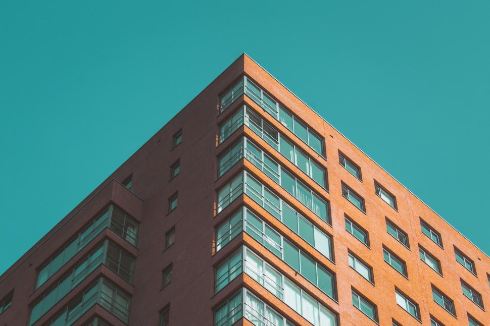 Free Image of Low angle view of a brick high-rise 