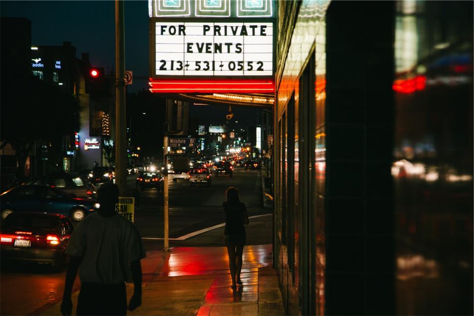 Free Image of Neon sign on city street during night 