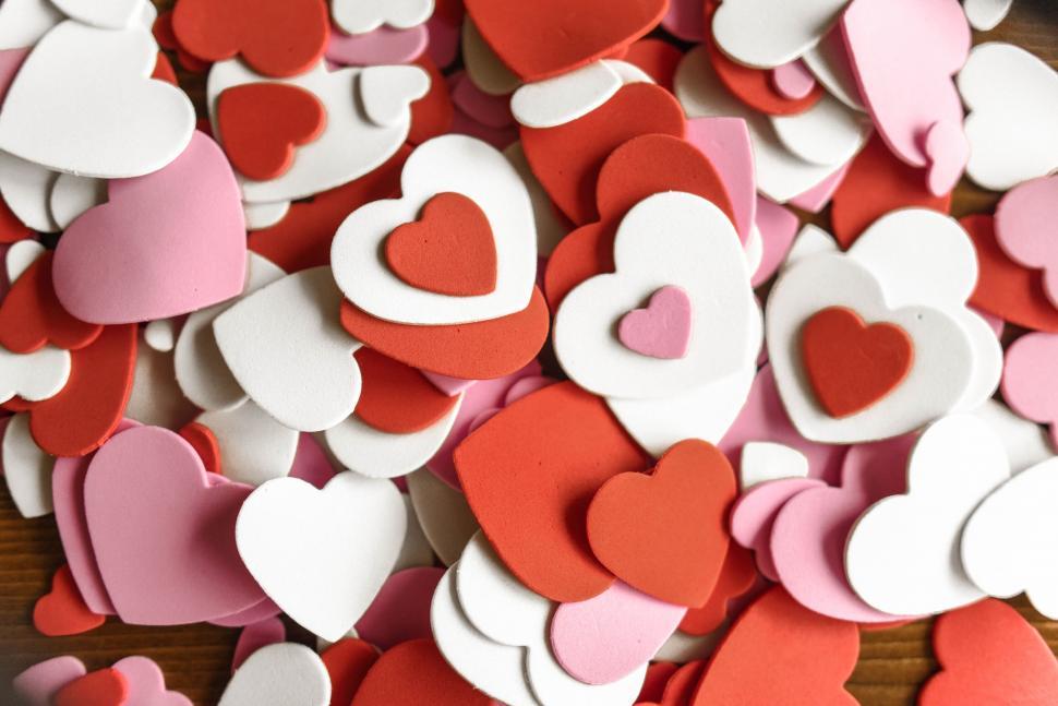 Free Image of Assorted red and white heart cutouts close-up 