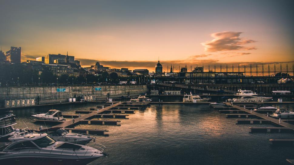 Free Image of Serene sunset over a harbor landscape 
