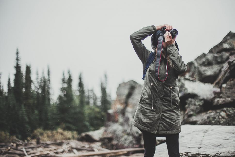 Free Image of Photographer capturing nature with a DSLR camera 